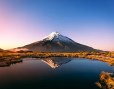 mountain near body of water during daytime