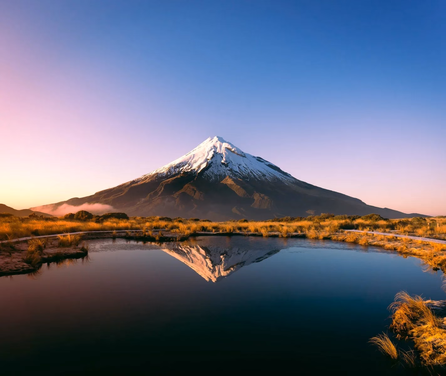 mountain near body of water during daytime